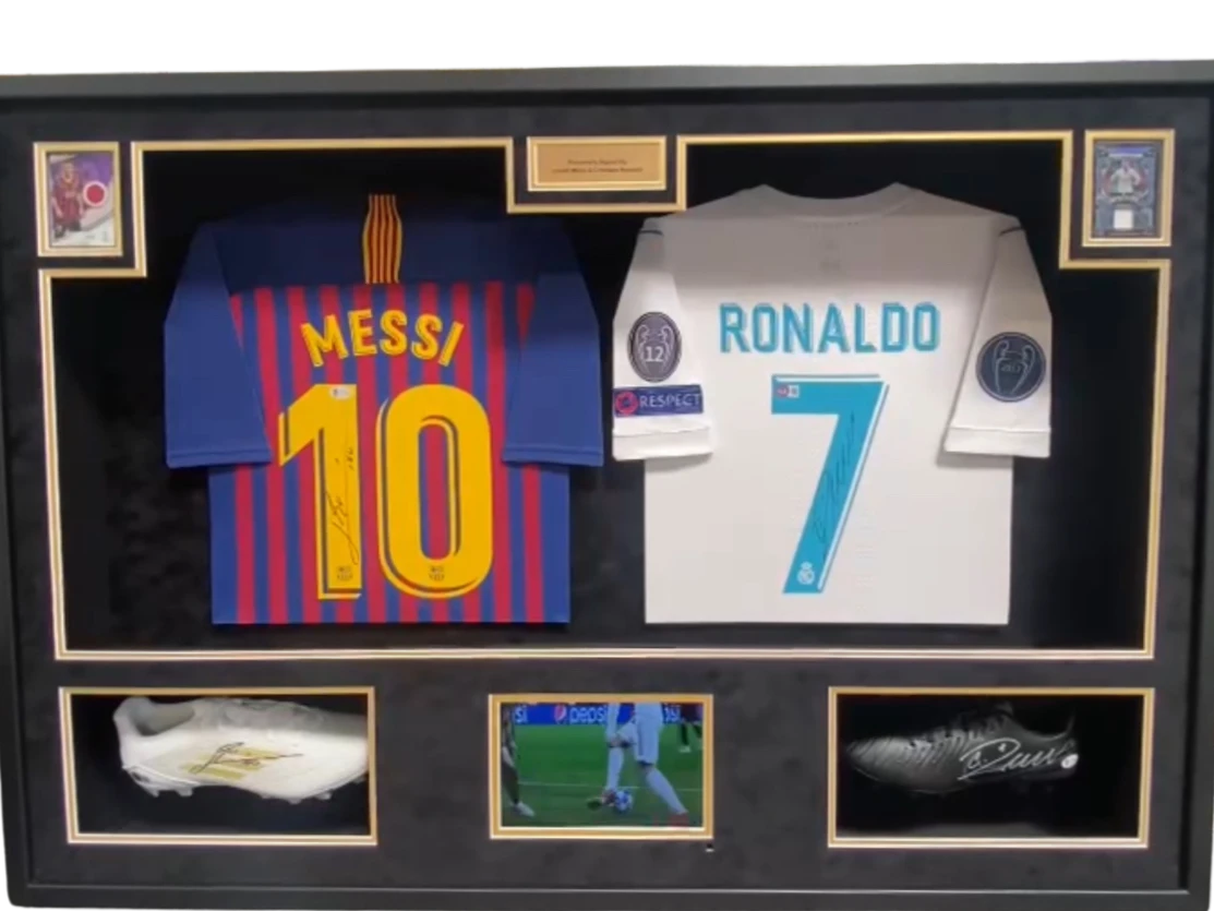 Framed signed Lionel Messi Barcelona & Cristiano Ronaldo Real Madrid Jersey Dual Display with Signed Boot, Match-Worn Patch Cards & Highlight Screen